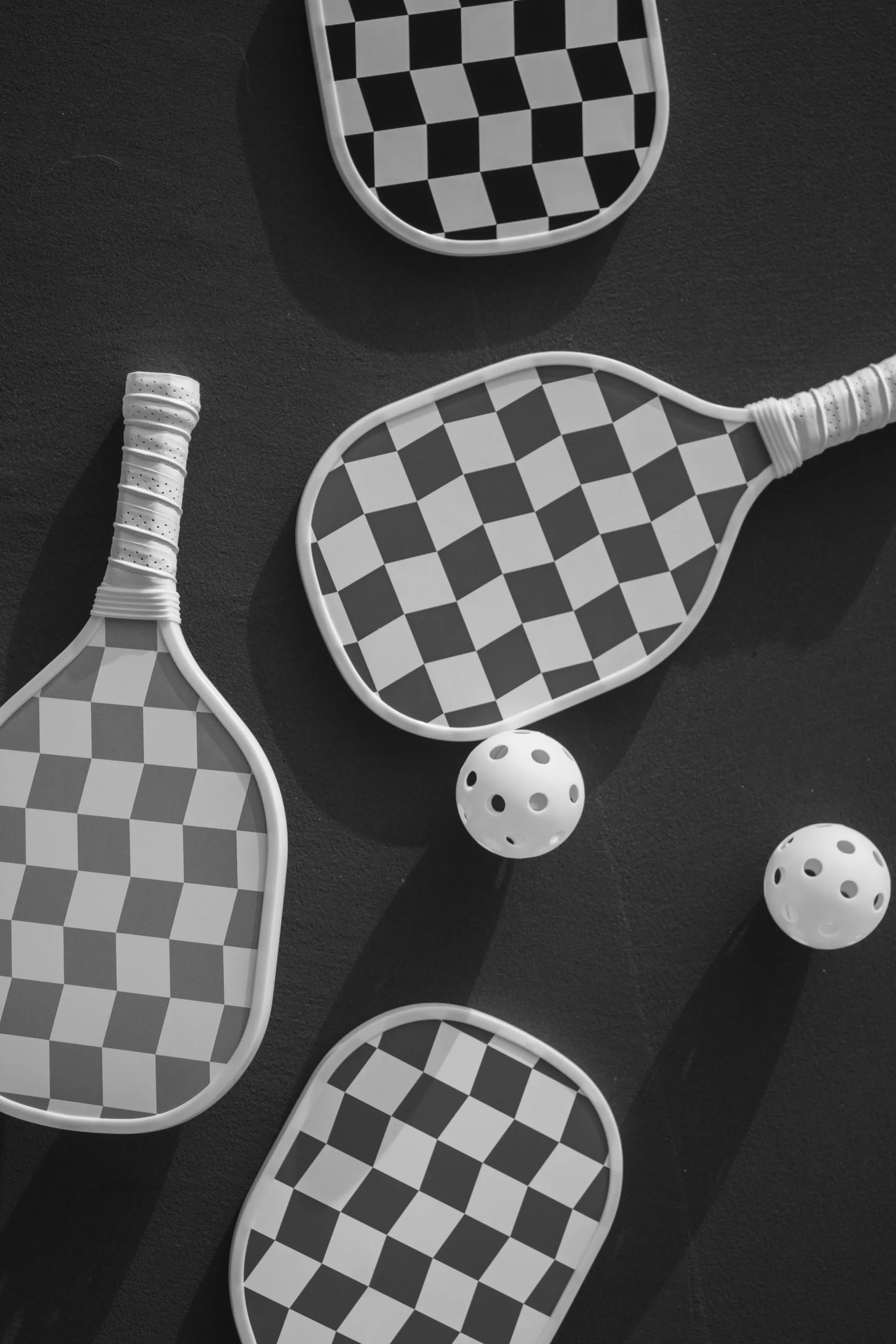 Checkered paddles and balls seen from above