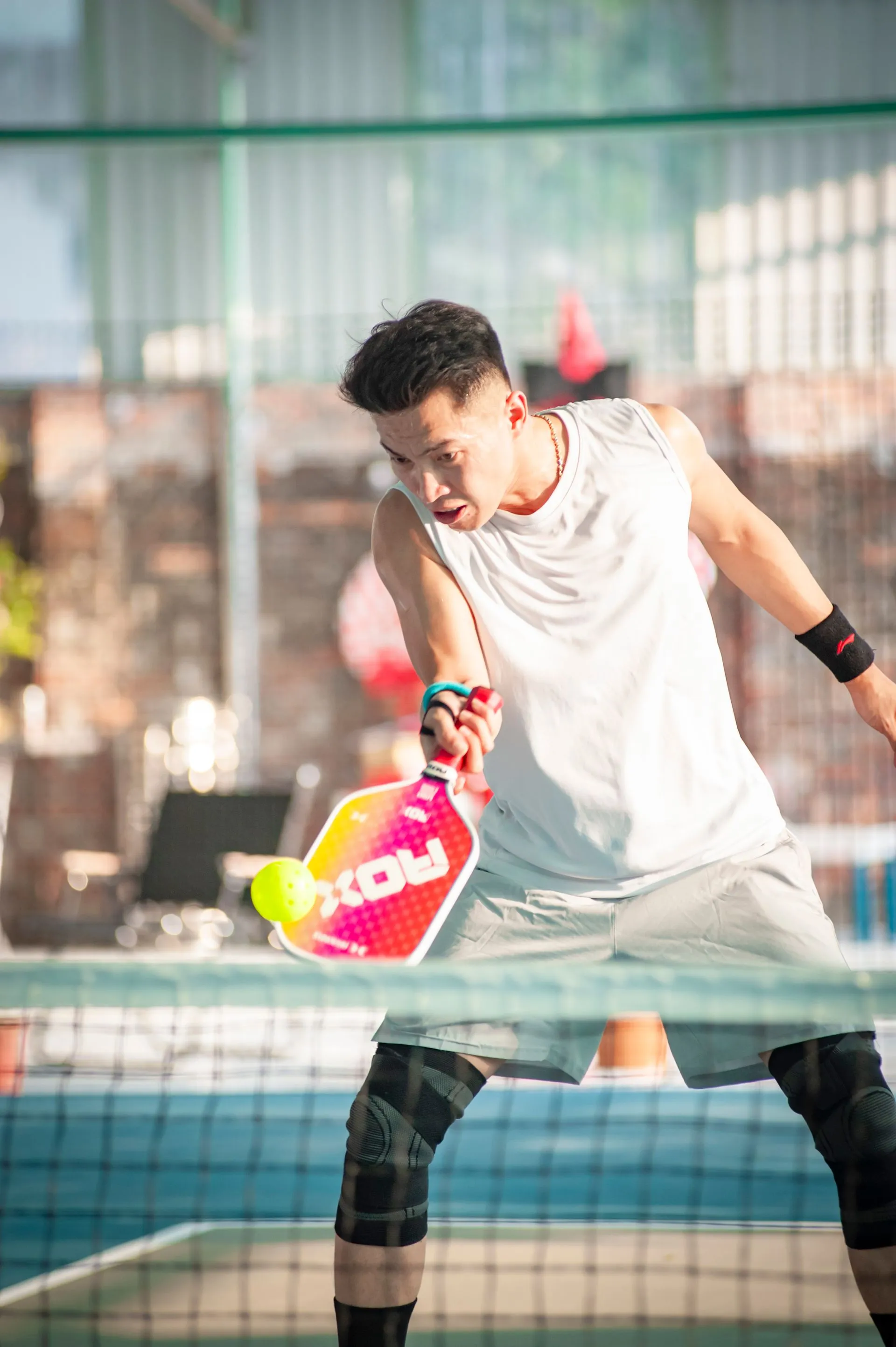 Player mid-swing at the net
